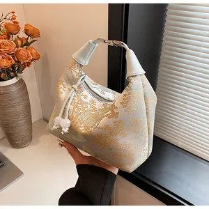 Detailed embroidery of pavilions and pine trees on light blue silk Chinese handbag