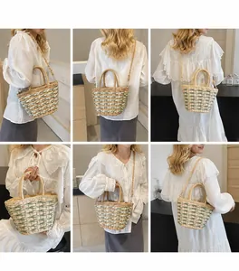 Multi-angle view of two-tone straw woven bucket bag with top handle and shoulder strap