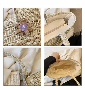 Detail view of woven straw bag featuring purple knit flowers and metal zipper closure