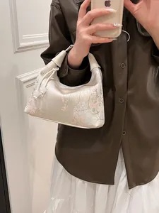 Elegant Chinese style embroidered handbag with floral patterns and silk bead drawstring
