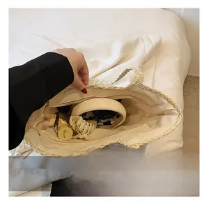 Top view of woven tote bag interior showing large capacity and zipper pocket