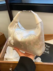 Elegant ivory silk handbag with floral embroidery and bamboo pattern for cheongsam