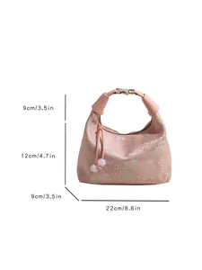 Pink jacquard handbag with traditional embroidery and tassel, 22x12x9cm dimensions