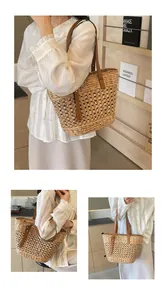 Close-up of hollow woven texture and premium brown leather handle on straw tote bag