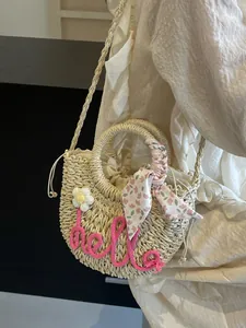Summer straw tote bag with pink Hello embroidery and floral scarf on light beige weave
