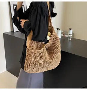 Detailed texture of hand-woven straw tote bag with large capacity for beach vacation