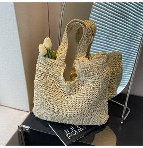 Close-up of beige woven tote bag with hollow mesh texture and decorative tulips