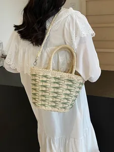 Handwoven straw tote bag with green stripes and detachable strap for beach summer vacation