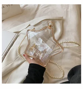 Sac à main en acrylique en forme d'étoile avec bordure dorée et bandoulière perlée