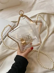 Sac étoile en acrylique transparent avec cadre doré et bandoulière perle