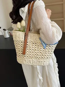 French style woven straw tote bag with brown leather straps for beach and vacation