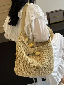 Handwoven straw shoulder bag in beige featuring large capacity and a relaxed boho style