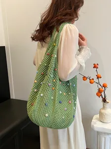 Green knit tote bag with colorful pearls for beach vacation and summer style