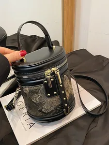 Elegant Chinese style bucket bag with golden butterfly embroidery and metal hardware