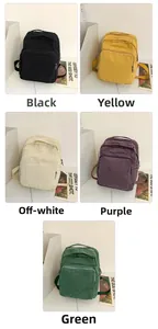 Vista detallada de mochilas de lona vintage en negro, amarillo, blanco, morado y verde