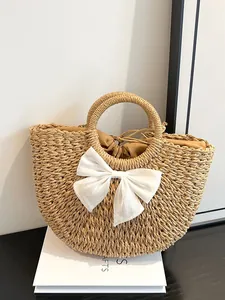 Sac à main pastoral en paille avec grand nœud blanc et cordon pour vacances à la plage