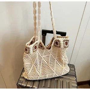 Close-up of crochet hollow tote bag with brown and white sunflower pattern detail