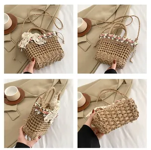 Detail view of khaki straw bucket bag with fabric flowers and lace bow accent