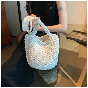 Close-up of handmade cream woven tote bag showing thick cotton rope texture and detail