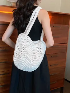 Bohemian white woven tote bag with chunky knit texture for beach vacations