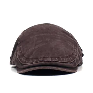 Detailed macro view of retro brown washed cotton flat cap texture and stitching quality