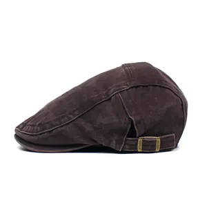 Detail view of washed cotton newsboy cap featuring an adjustable vintage brass buckle