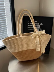 French style woven tote bag in cream and tan contrast with a lace bow accent