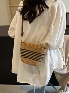 Fashionable striped woven crossbody straw bag with leather strap for summer beach beachwear