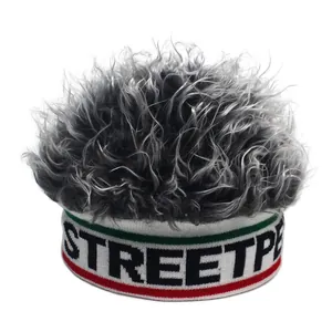 Detail of the fun wig beanie featuring tricolor stripes and STREETP woven lettering