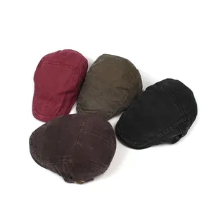 Detail view of four vintage washed cotton flat caps in red, green, black and brown