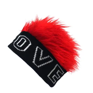 Detail of knit beanie with red faux fur mohawk and white LOVE lettering embroidery
