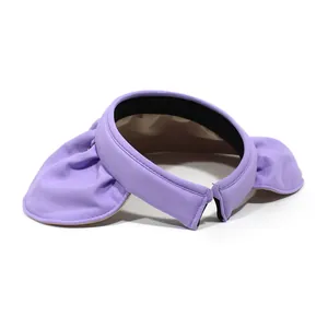 Detail of purple foldable sun hat with wide brim showing sweatband and soft fabric texture
