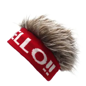 Detail of red knitted headband with grey faux hair and white HELLO!! text design
