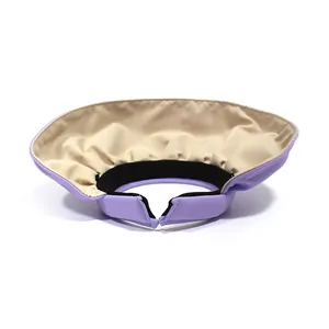 Detail view of purple sun visor with black sweatband and beige lining for women
