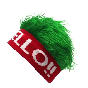 Detail of red knitted beanie featuring green faux hair wig and HELLO text embroidery