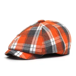 Klassieke oranje en grijze geruite krantenjongenspet met vintage textuur voor dames