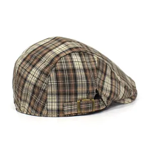Detailed view of the adjustable metal buckle and vintage plaid fabric on the cap