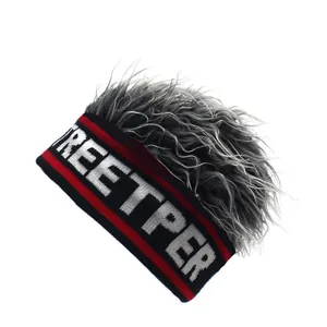 Detail of knit beanie with Streetper lettering and fluffy silver wig hair attachment