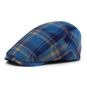 Classic British style blue plaid flat cap with a vintage cotton blend texture