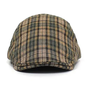 Close-up of the vintage brown plaid pattern and texture on this stylish flat cap