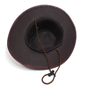 Detail of dark brown faux leather cowboy hat with adjustable chin strap and secure toggle
