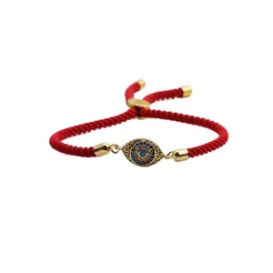 Adjustable red braided evil eye bracelet with gold accents and cubic zirconia stones