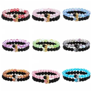 Detail view of crown bead bracelet sets in various colors like tiger eye and matte black