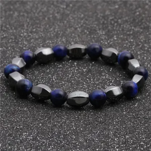 Macro shot of blue tiger eye cat eye beads and faceted hematite beaded bracelet