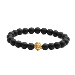 8mm black matte stone beaded bracelet set with golden lion head and crown charm