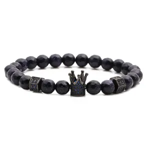 Bracciale di perline in pietra arenaria blu con corona in metallo nero e cristalli