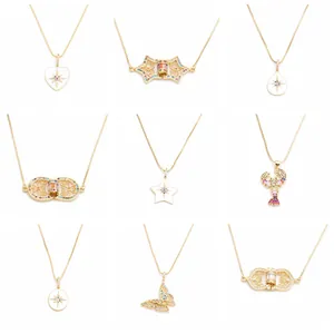 Macro display of nine distinct gold heart and butterfly pendant necklaces with zircons