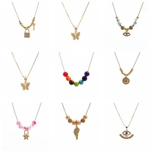 Set of 9 gold-plated Halloween necklaces featuring skull, butterfly, and evil eye pendants
