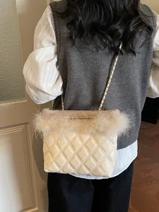 Quilted off-white chain bag with feather trim and gold-tone hardware for women