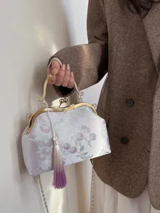 Elegant Chinese style embroidered evening clutch bag with gold ring handle and tassel